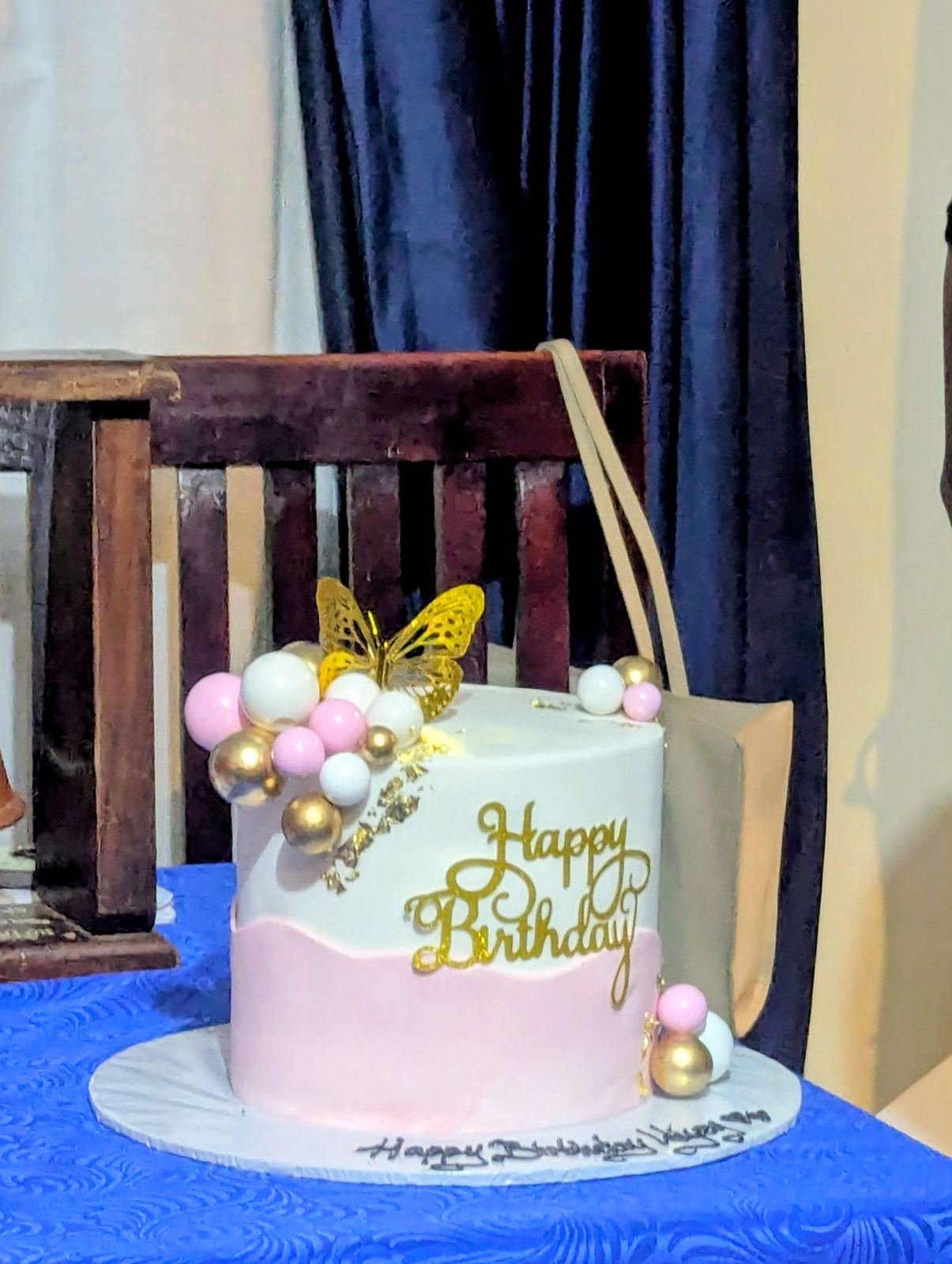 Happy birthday cake on a decorated cake table