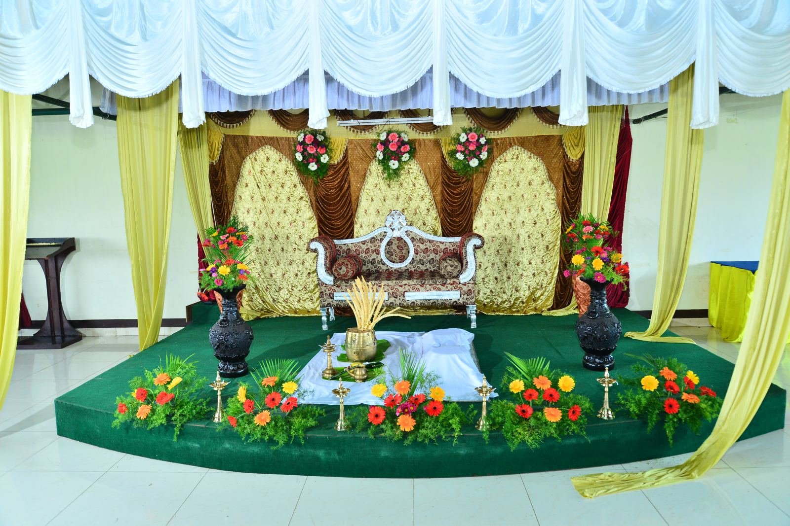 Floral wedding stage with royal chairs
