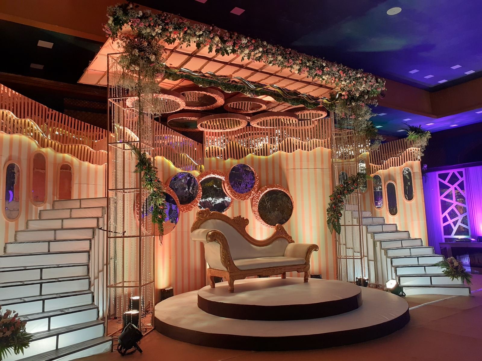 Luxury wedding stage decoration with drapes and lights
