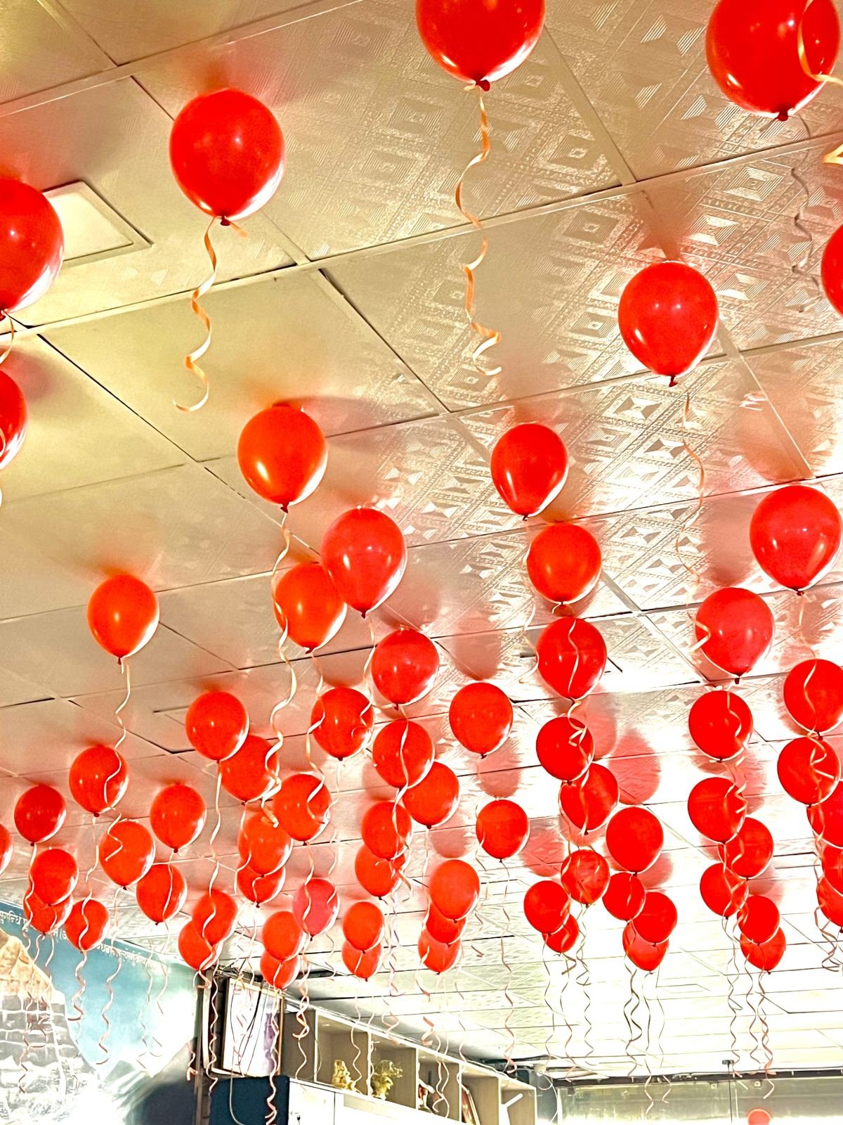 Red balloon ceiling decoration for a party