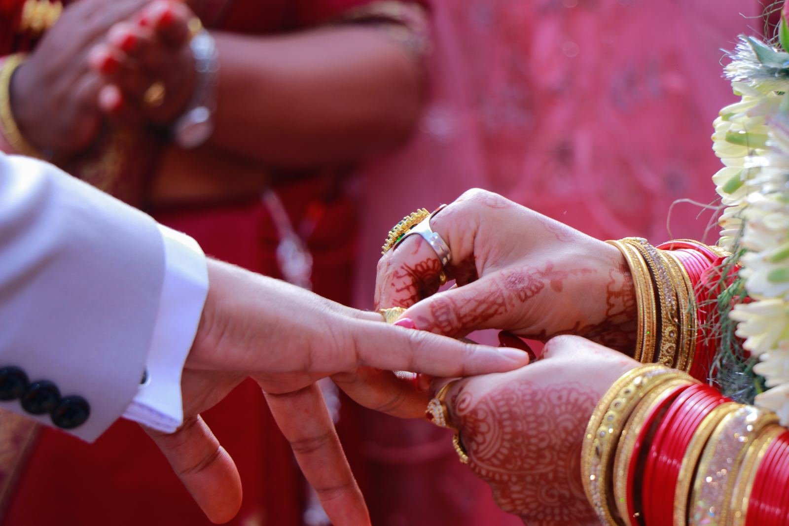 Couple exchanging rings at an engagement ceremony