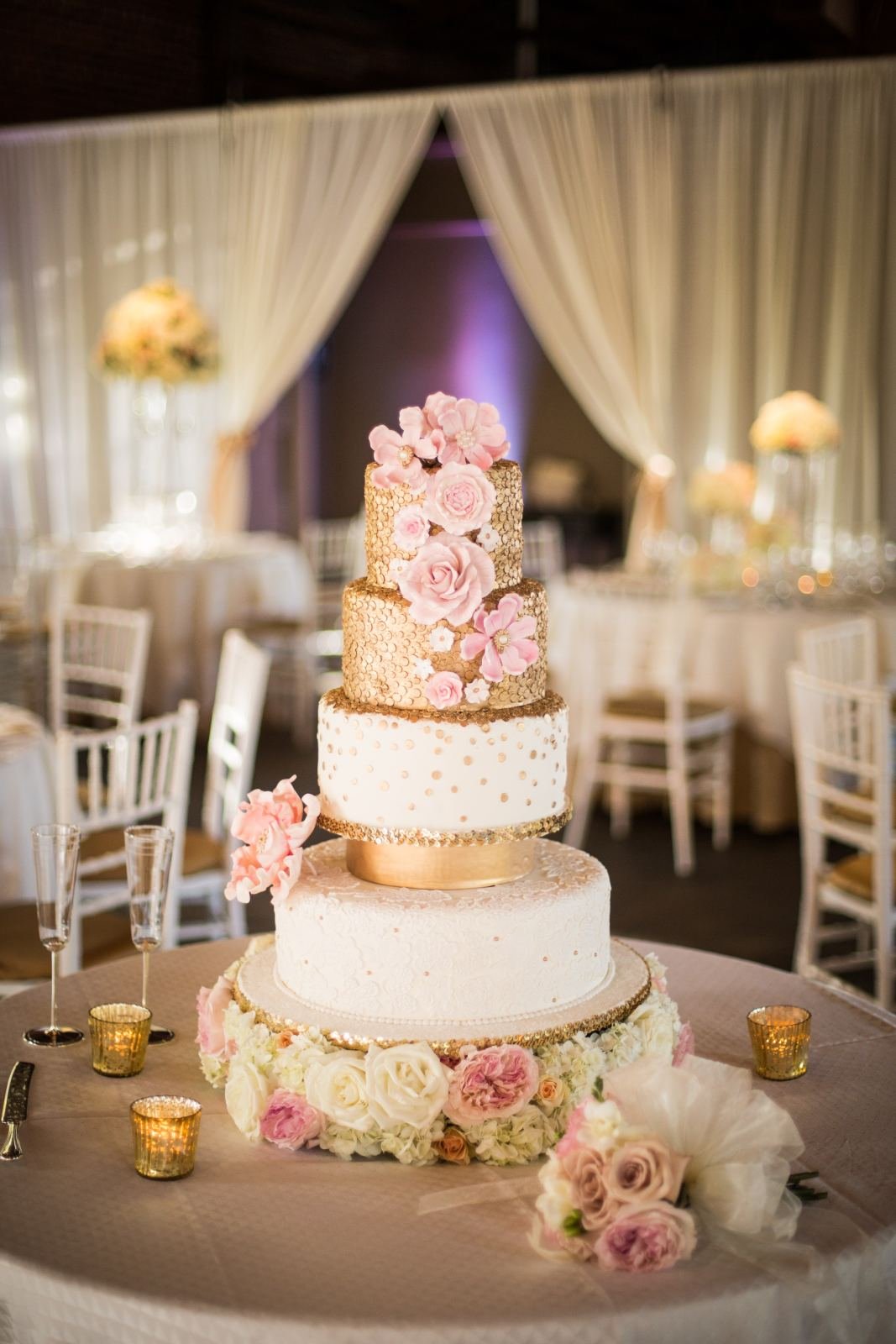 Tiered wedding cake with pink flowers
